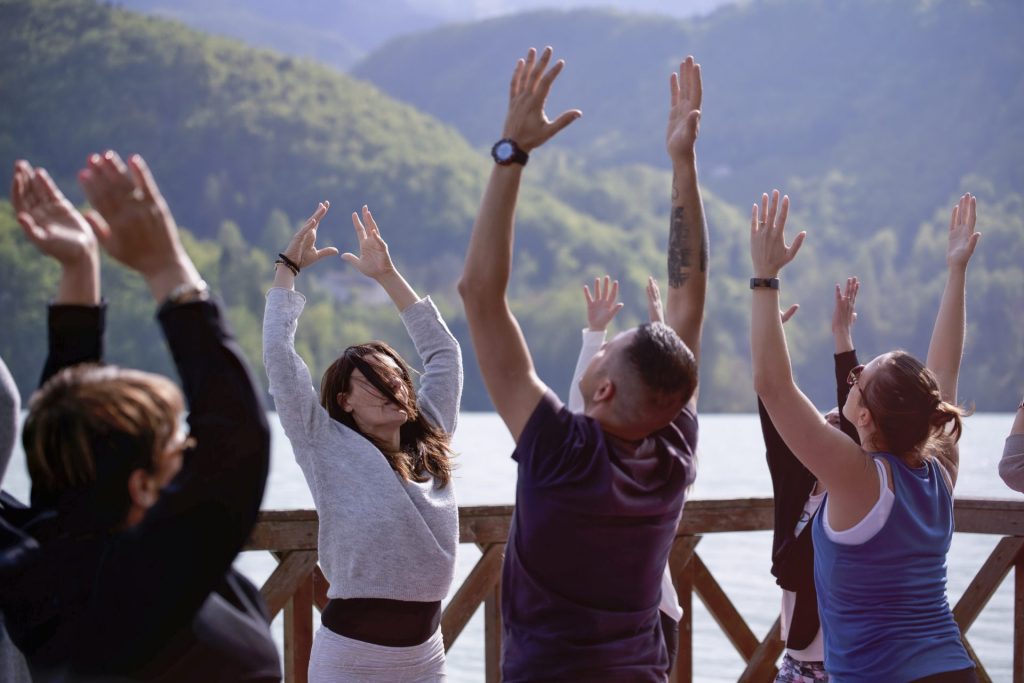 Group of people practicing embodiment yoga together